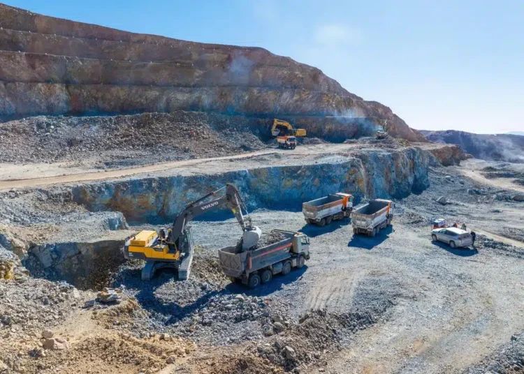 Open-pit mine with excavators and dump trucks